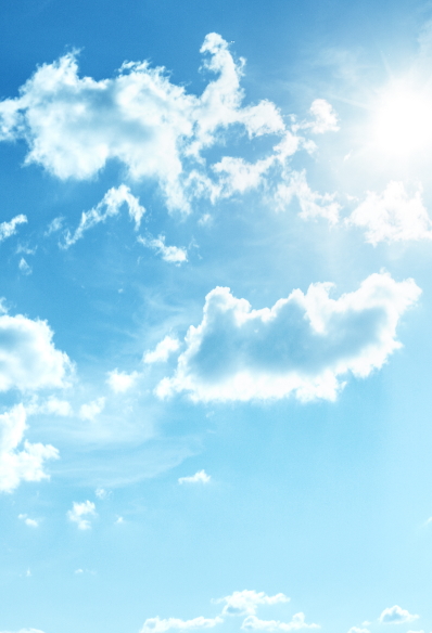 Image of sunny, blue sky filled with white clouds.